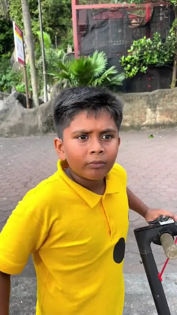 confused msian boy talking a man at batu caves