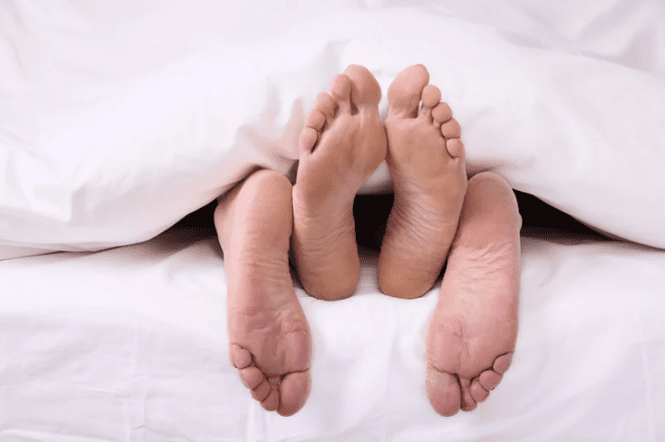 Couple sleeping in bed