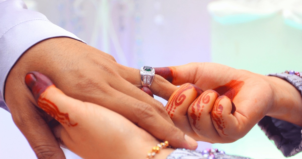 couple wearing rings