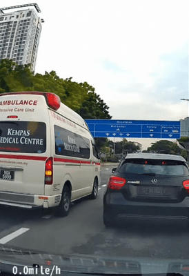 Ambulance cutting into Mercedes' lane