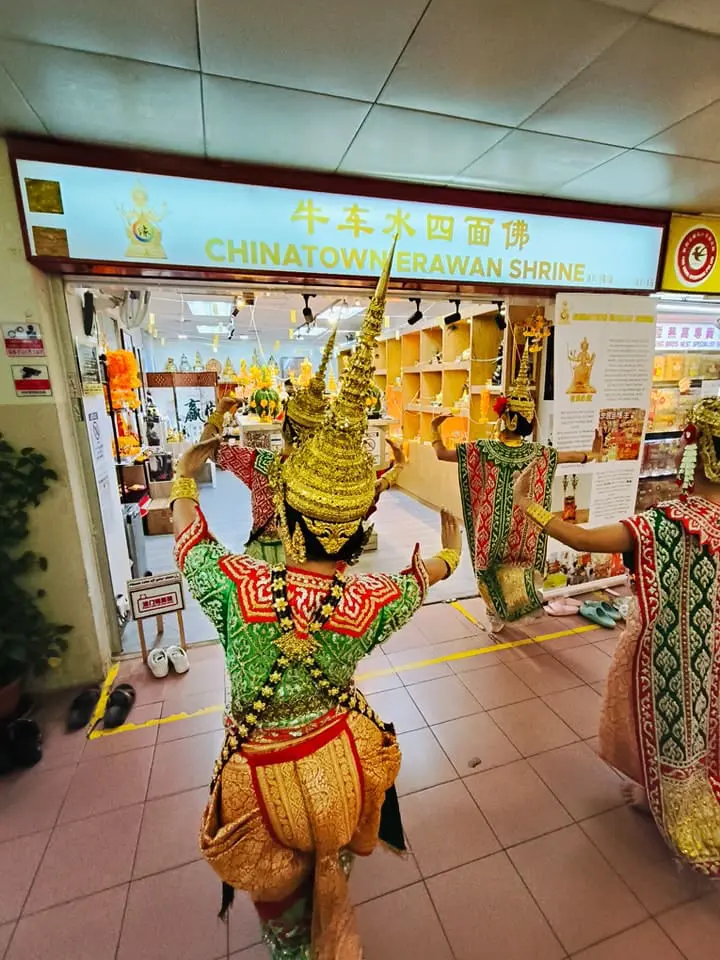 Dancers in front of Chinatown Erawan Shrine