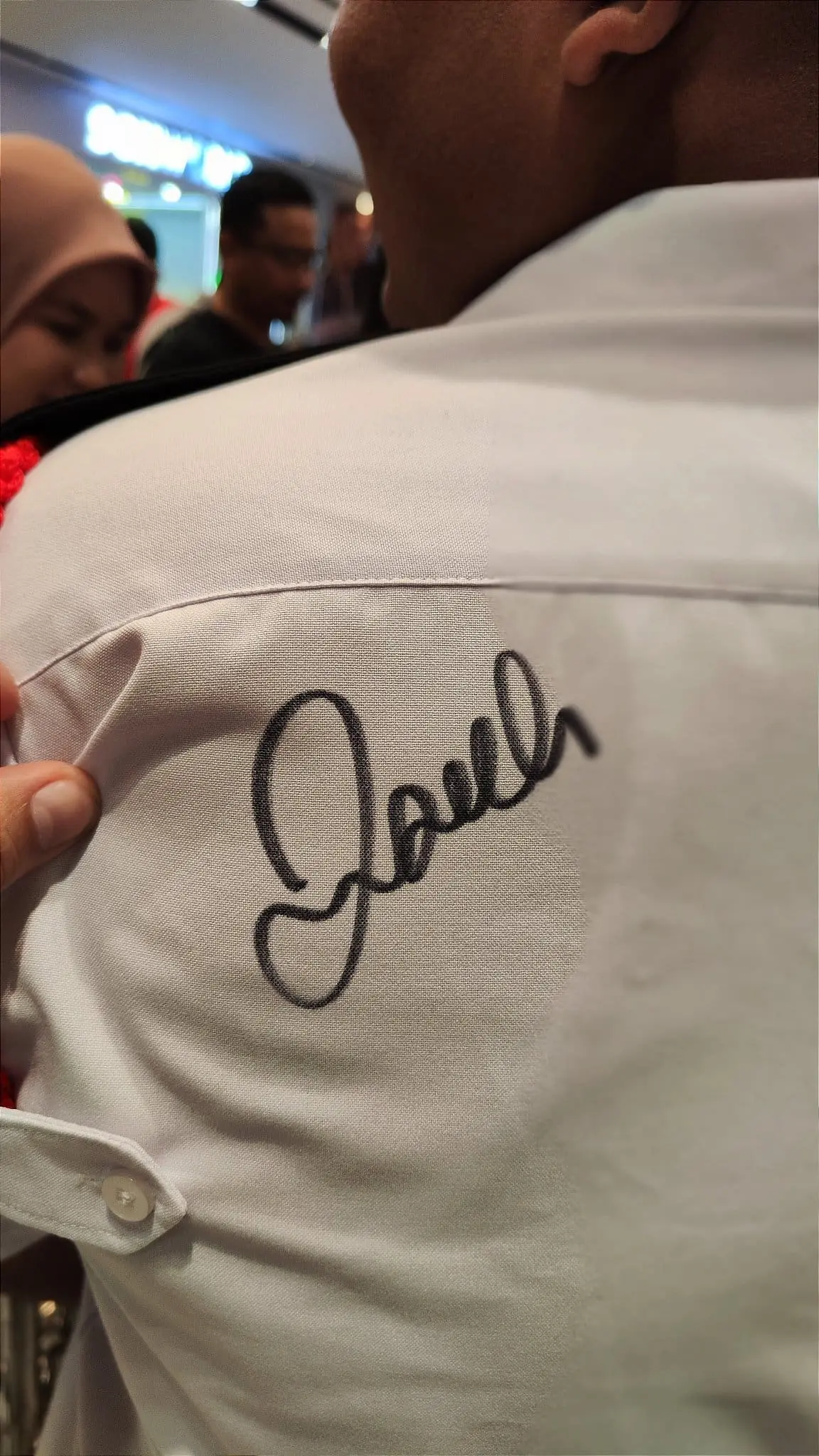 David Beckham signature on a security guard's uniform