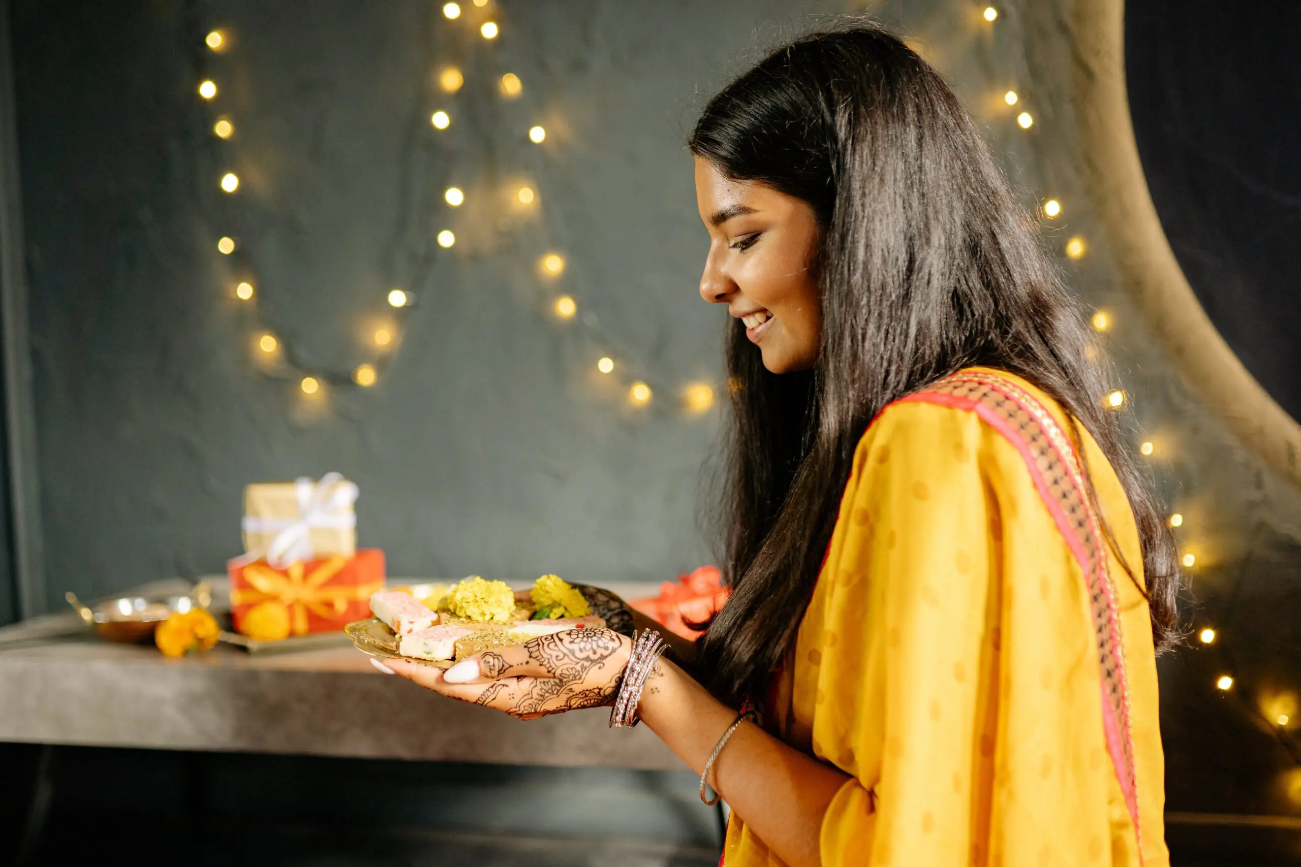 Girl holding lamp during Deepavali