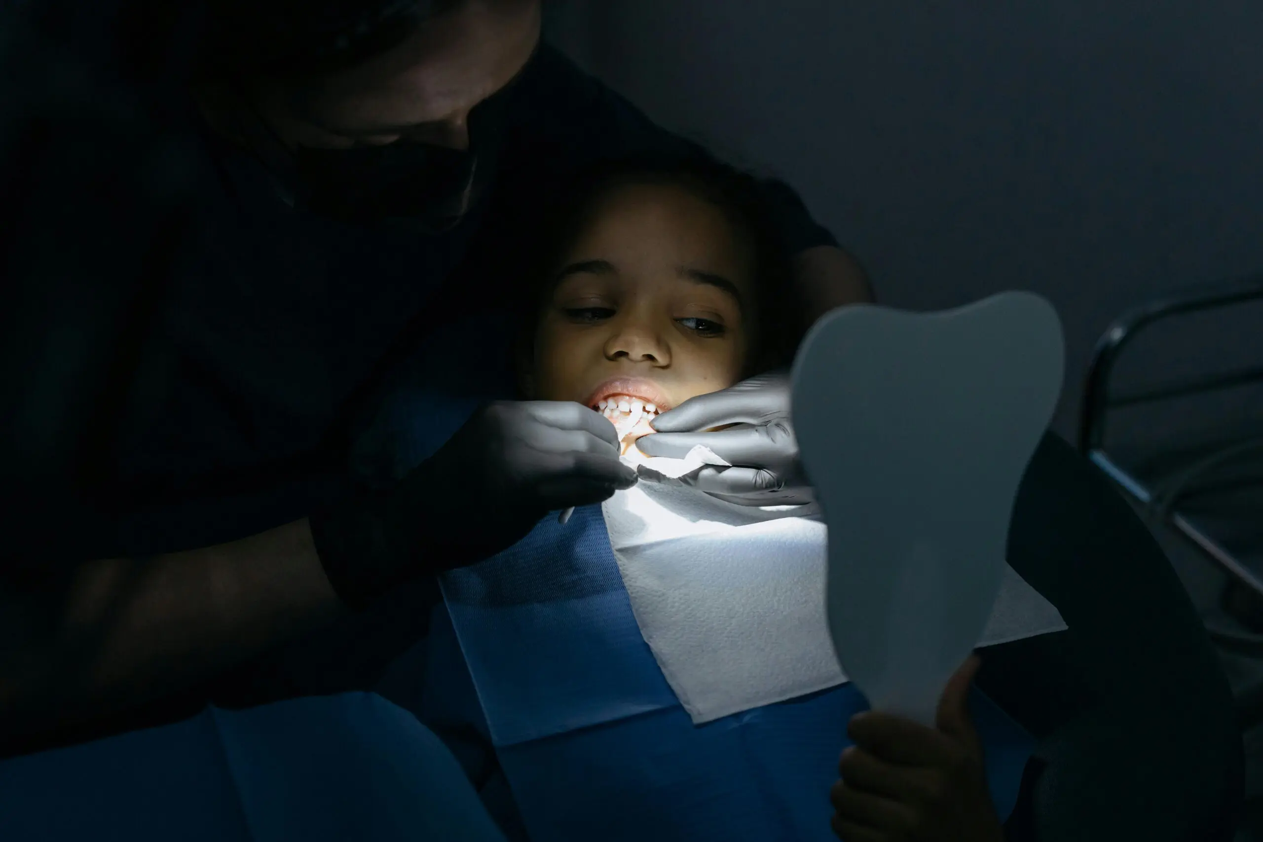 dentist repairing patient's teeth