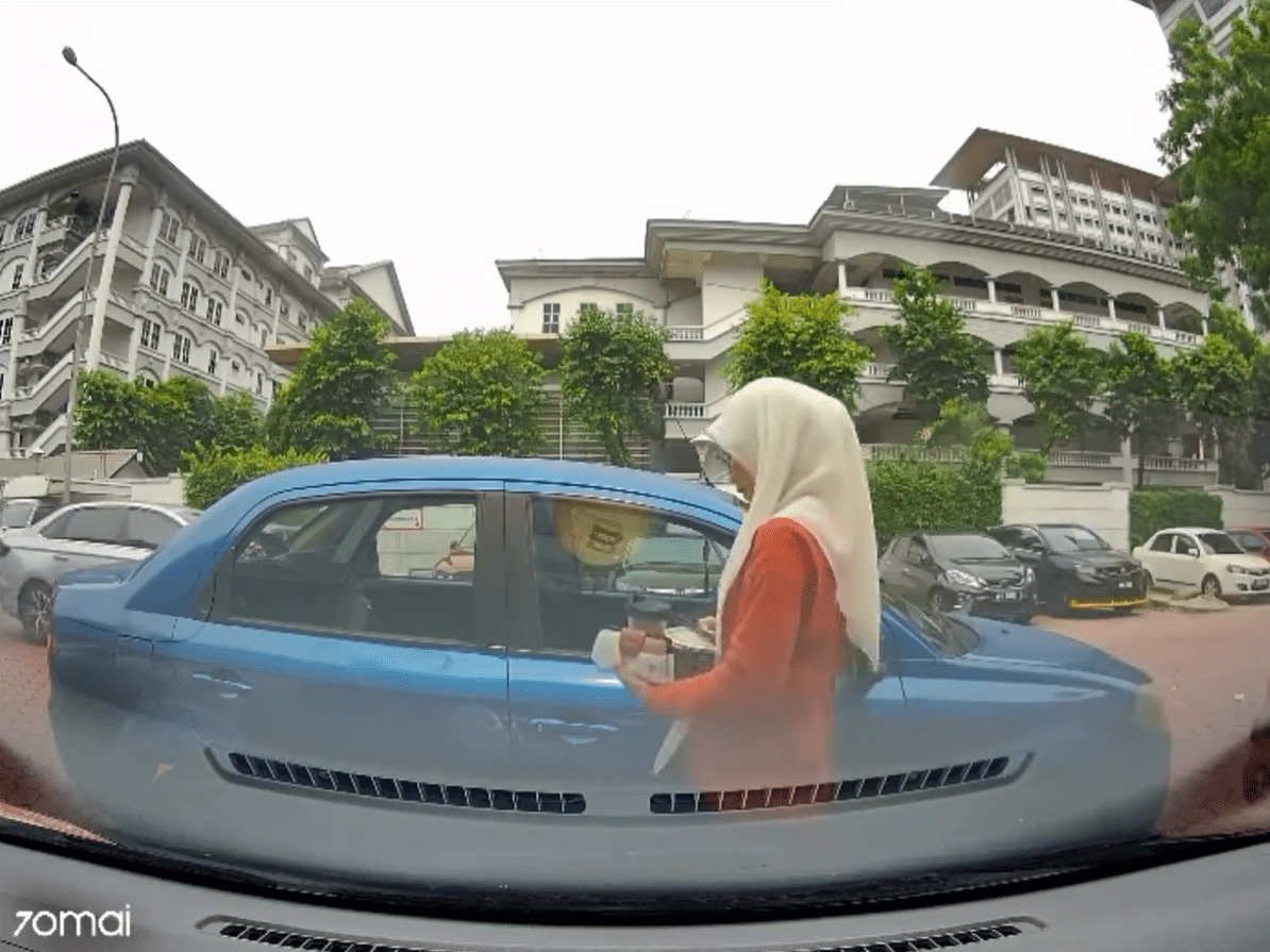 Double parked Proton Waja owner appears