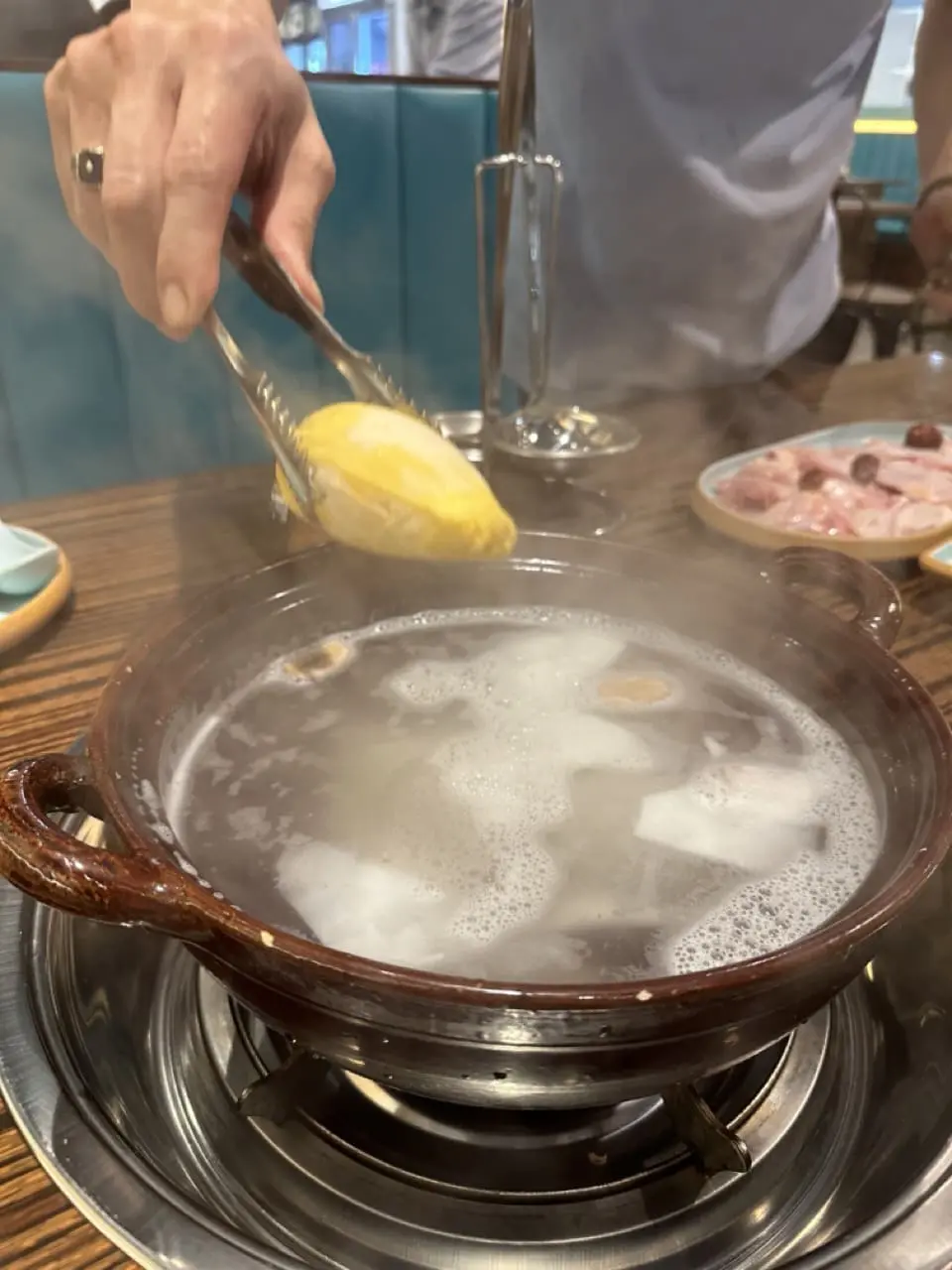 Durian flesh being added to coconut water