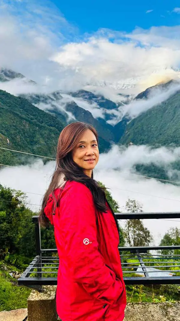 Zhang Ruixin standing at one of the mountains