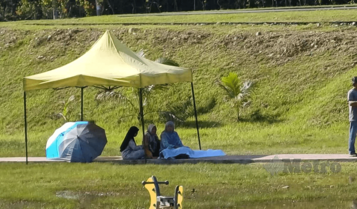 Family members sitting with the body of ex-rugby coach who died while jogging