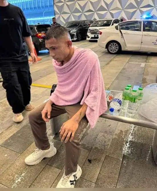 Faisal Halim sitting on a bench