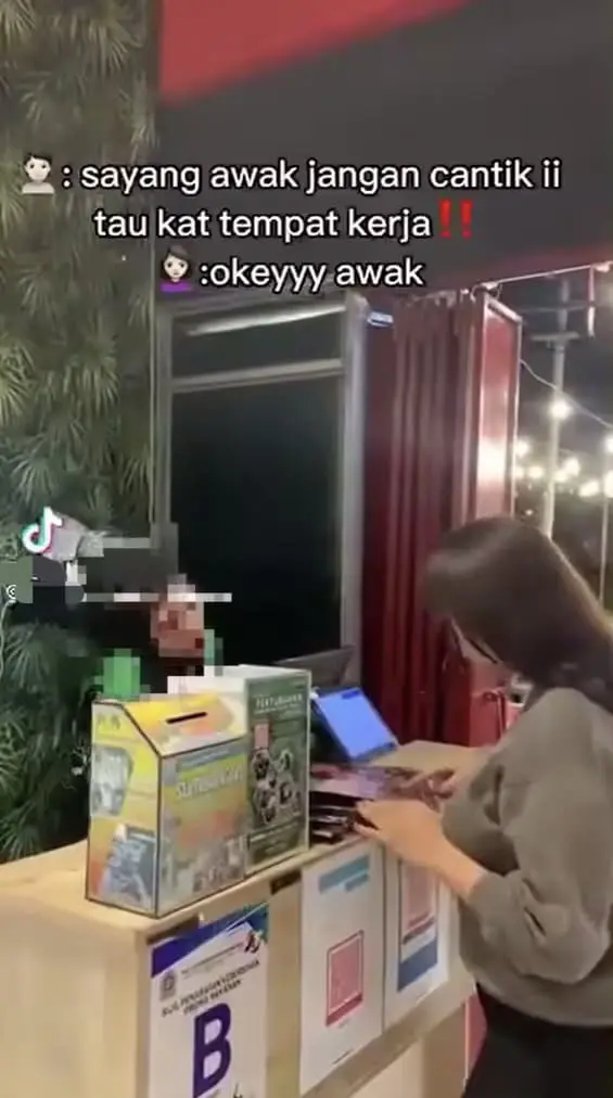 Fake OKU staff serving customer