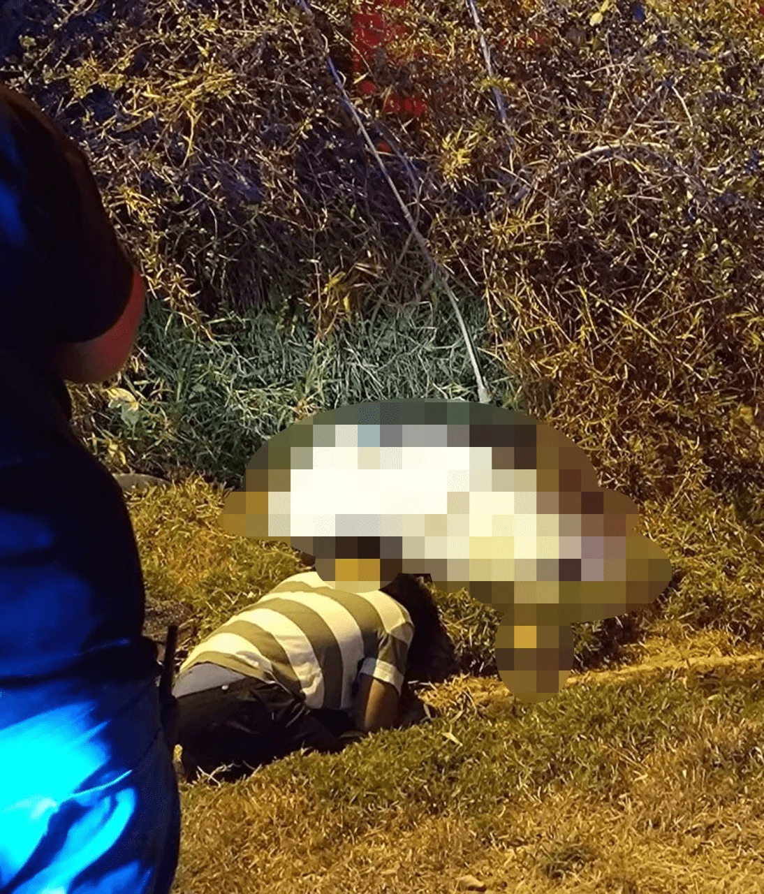 Family members mourning over victim's body