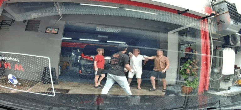 Father and son gang up on car wash attendant