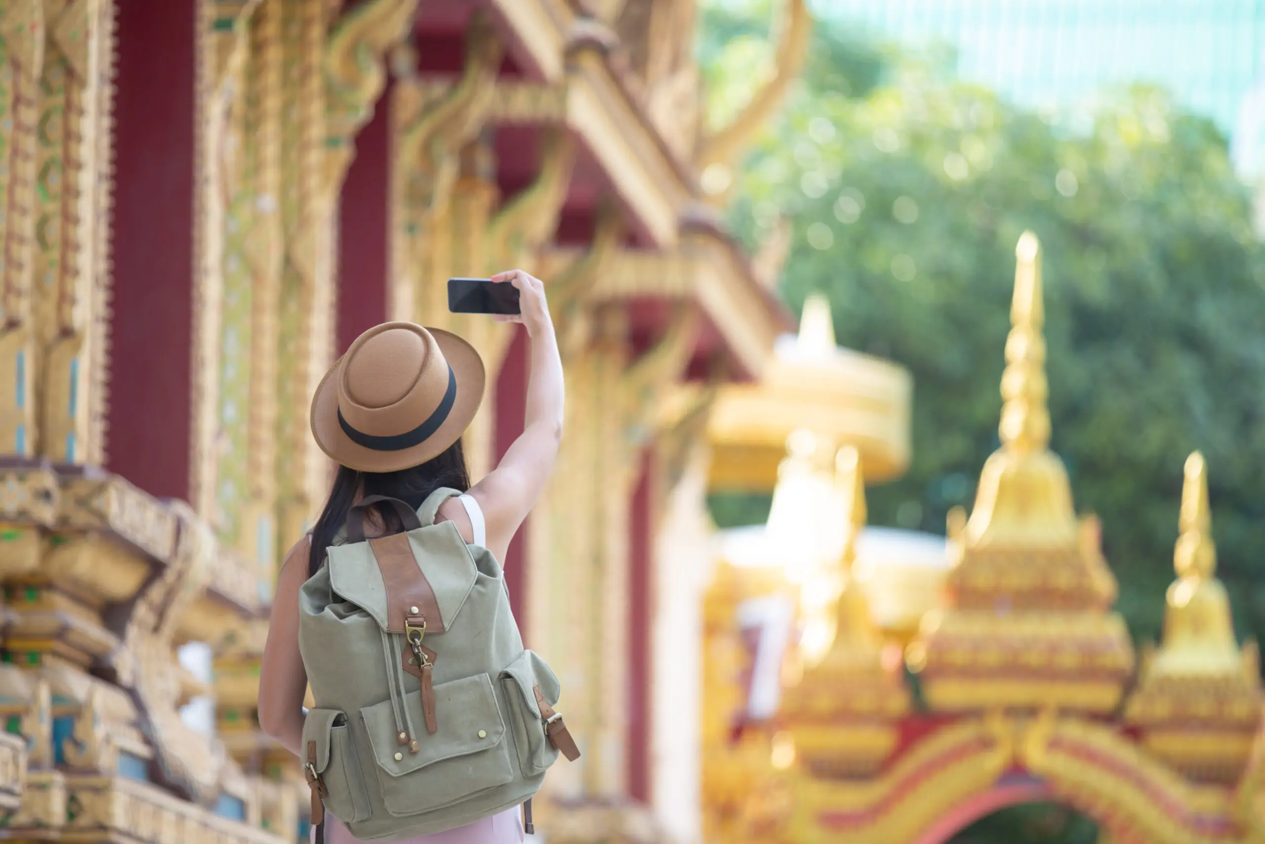 Tourist taking picture of Bangkok's tourist sites