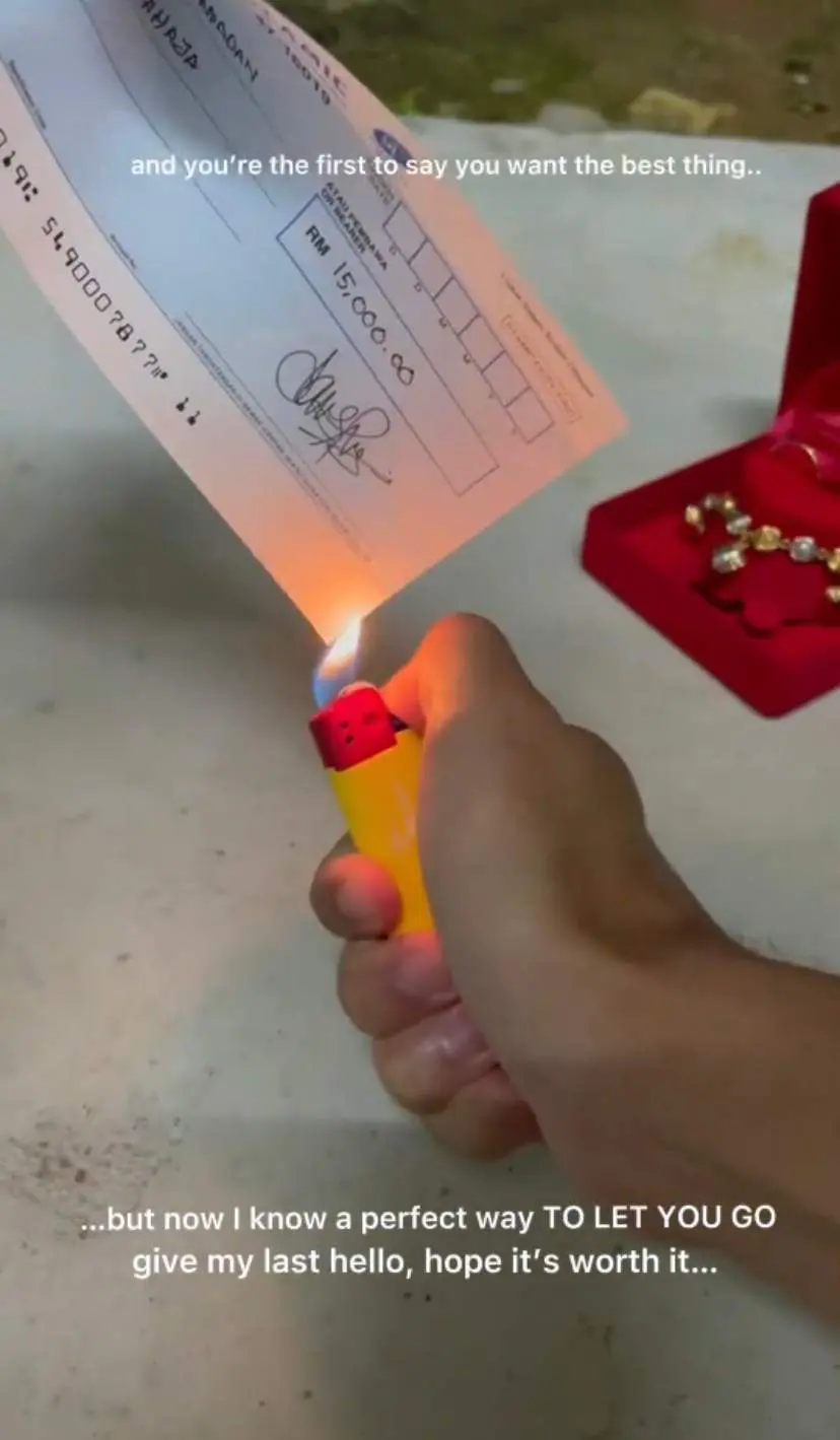 Ferdaus burning the cheque