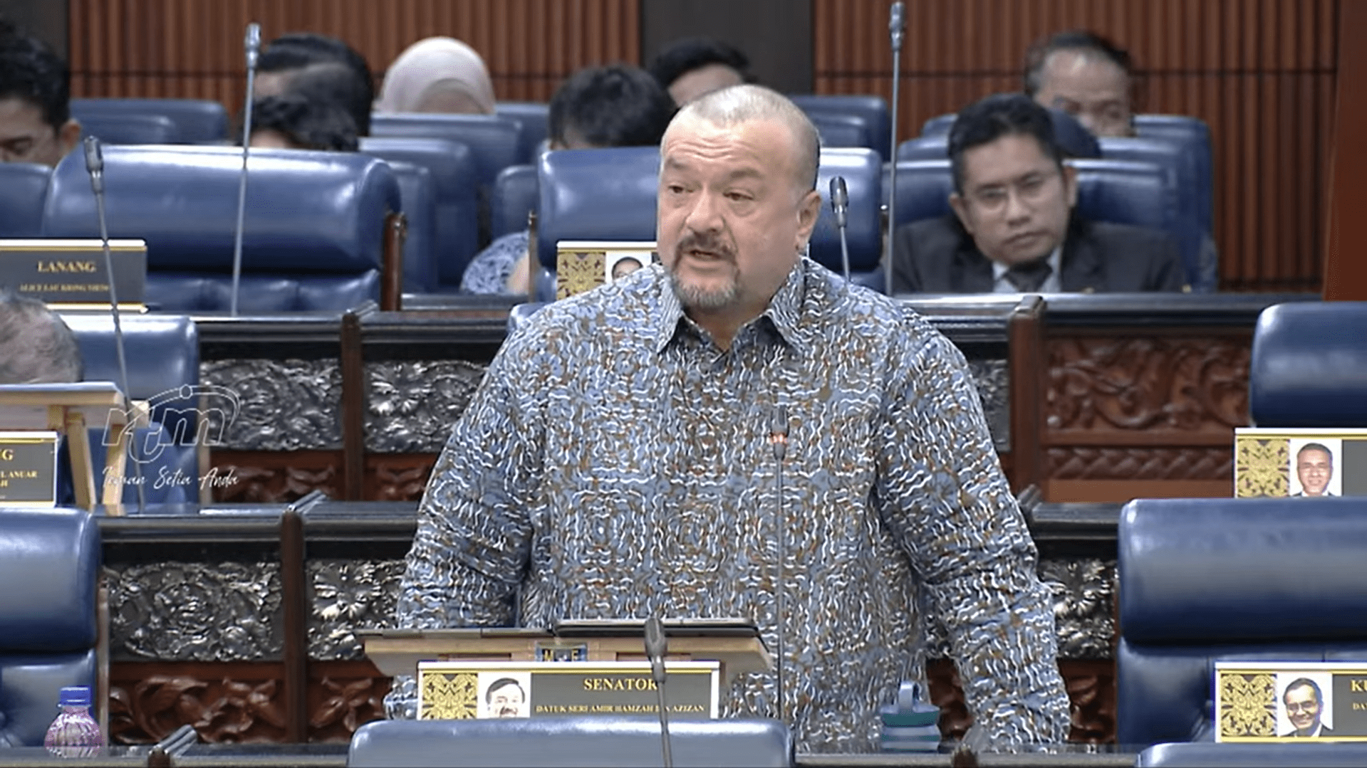 Finance Minister II answering question about insurance