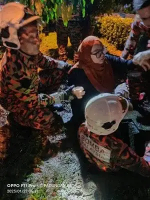 Firefighters rescue woman from drain