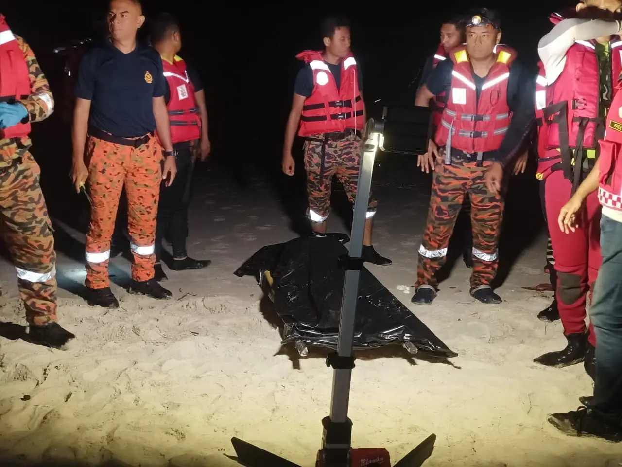 firemen with a dead body found drowned in port dickson