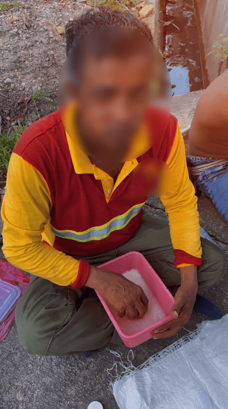 foreigner eating his simple water rice meal