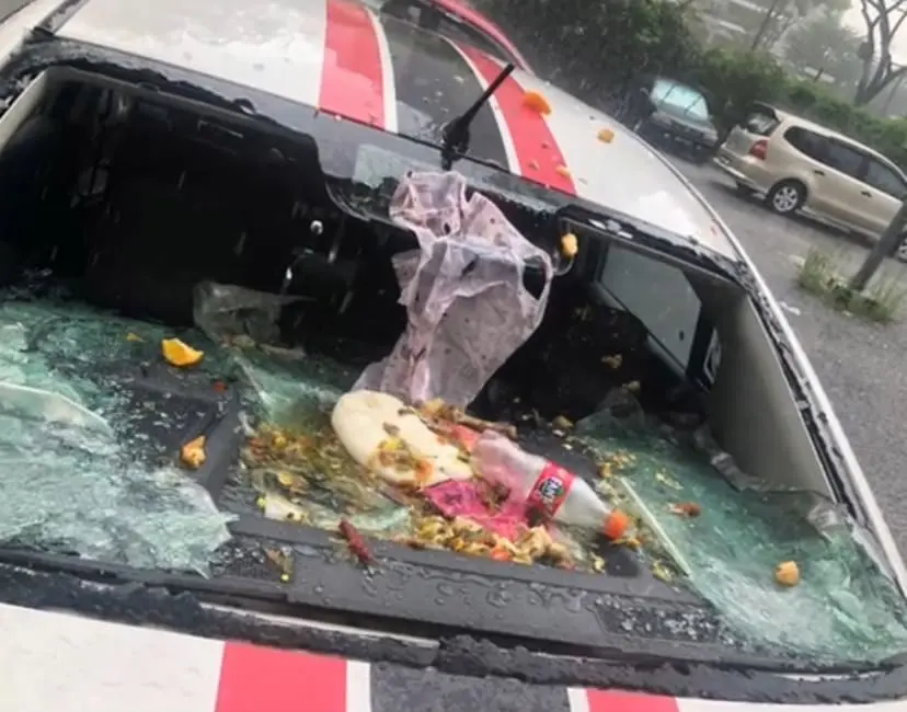 M'sian Woman's Windscreen Smashed After Selfish Resident Throws Rubbish From Top Floor