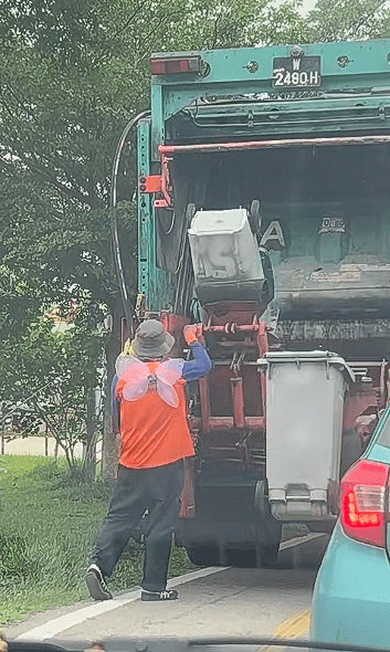 Garbage truck worker with wings (1)
