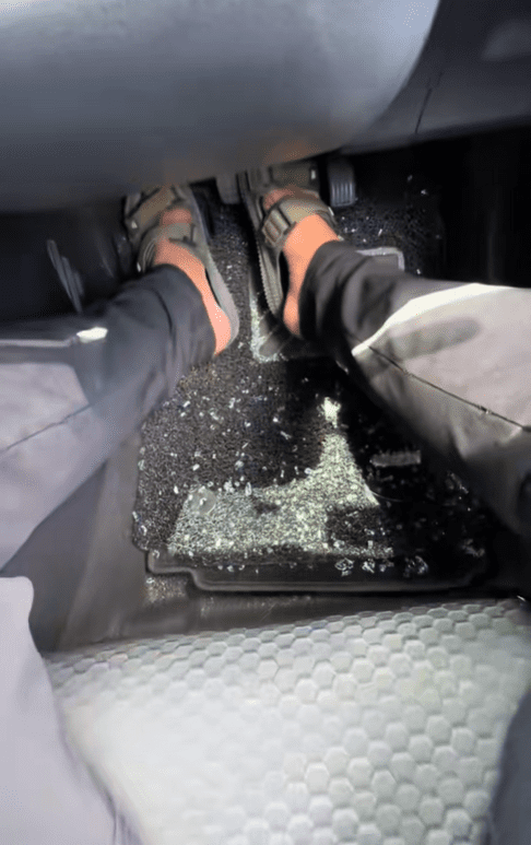 Glass fragments inside Myvi's floorboard