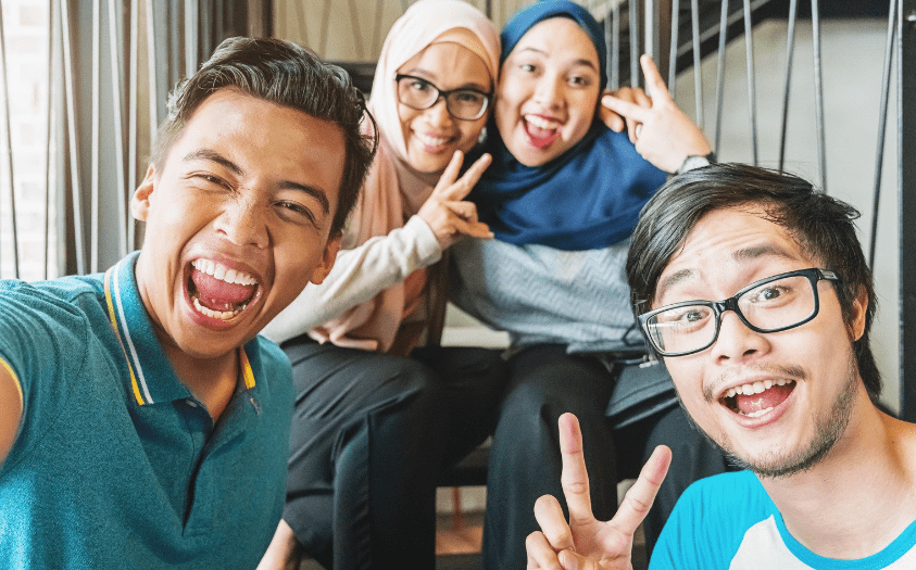 groups of malaysians taking selfies