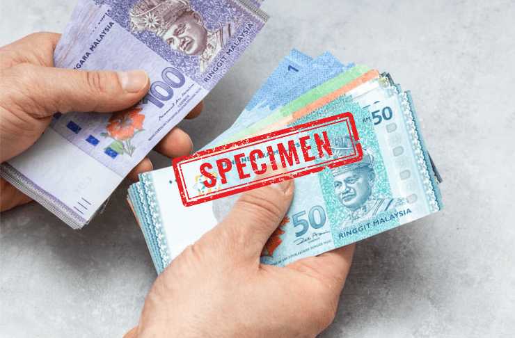 Hands holding Ringgit