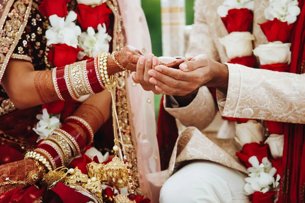 hands-indian-bride-groom-intertwined-together-making-authentic-wedding-ritual