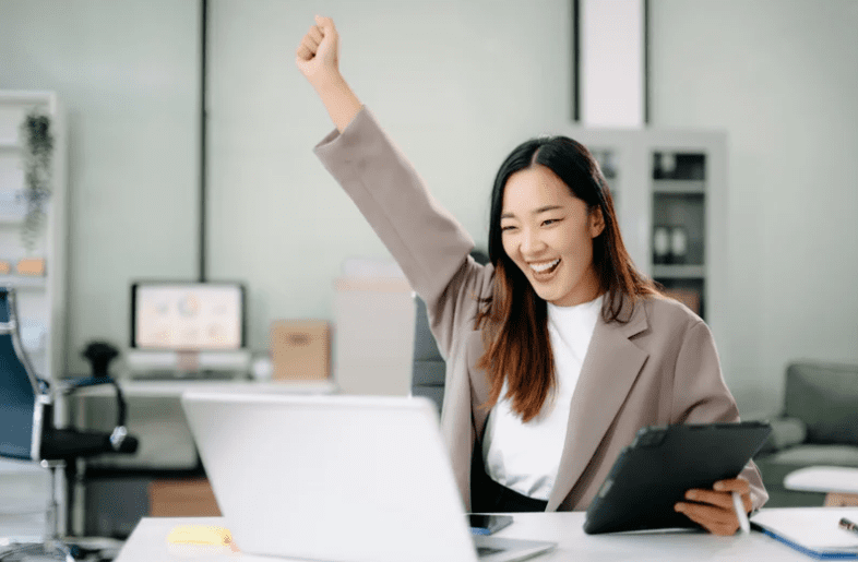 happy Asian woman at work