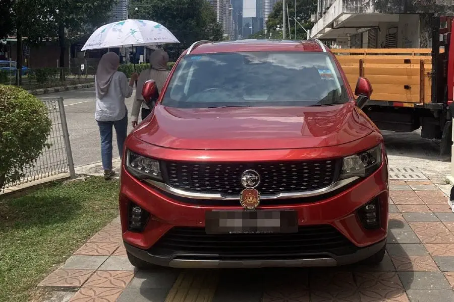 Hasbie Muda's car on pedestrian walkway
