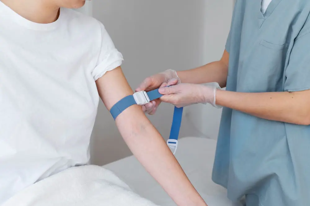 healthcare-professional-preparing-arm-blood-draw-high-angle