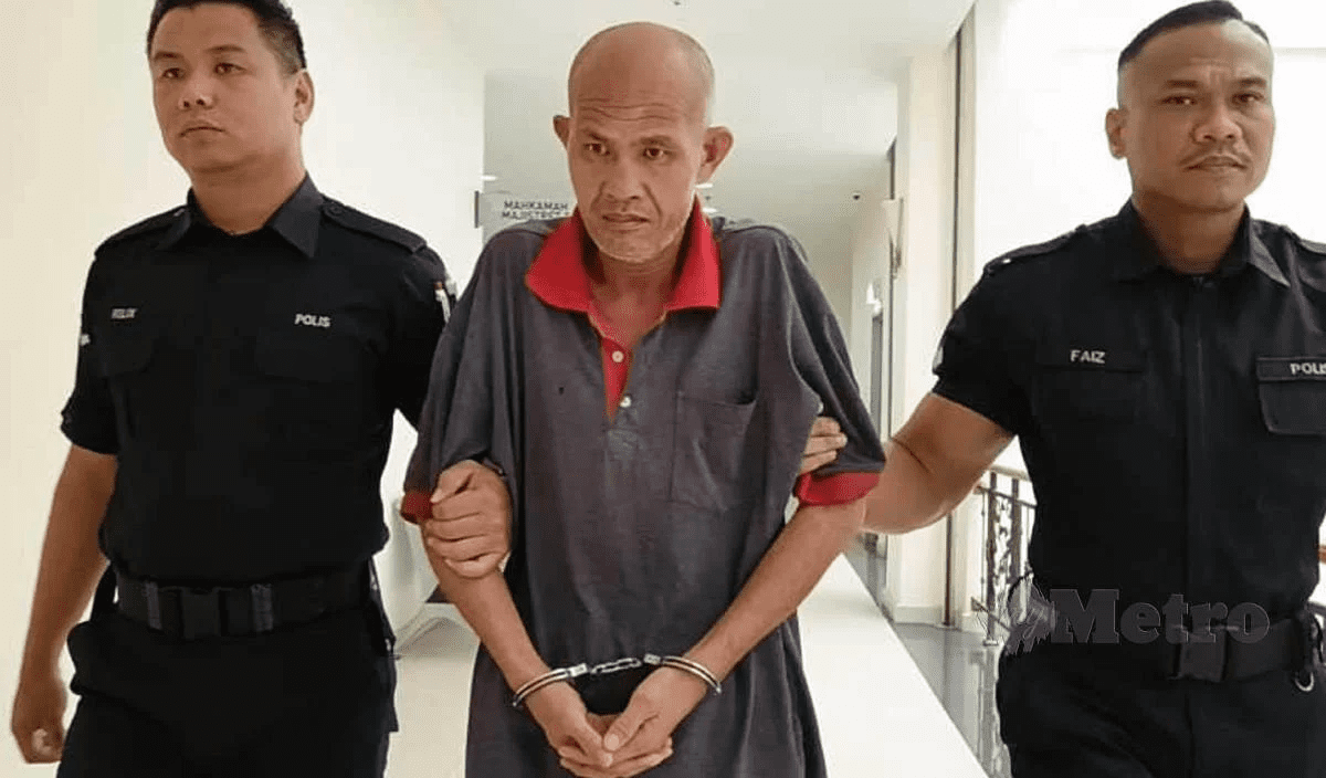 Ho Khek Chung in handcuffs