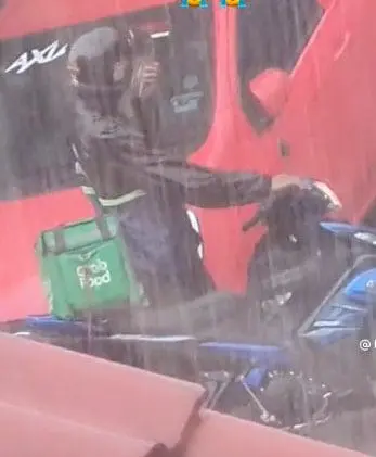 GrabFood rider in the rain