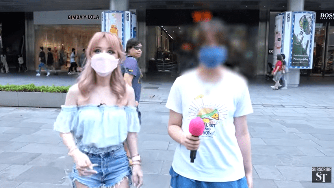 Here she is! Infamous "Badge Lady" is out of jail and maskless once again