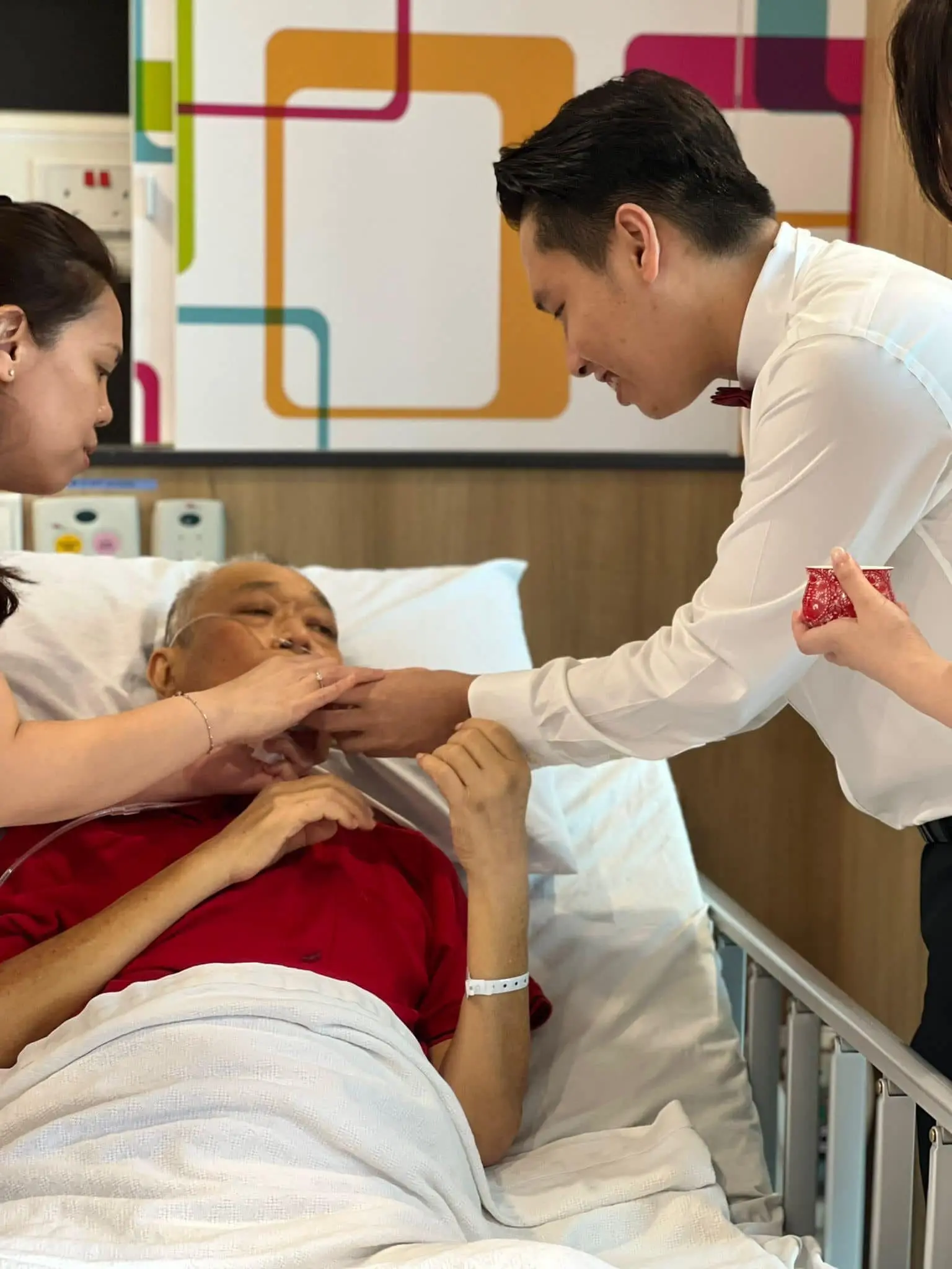 Marcus serving tea to Phoebe's father