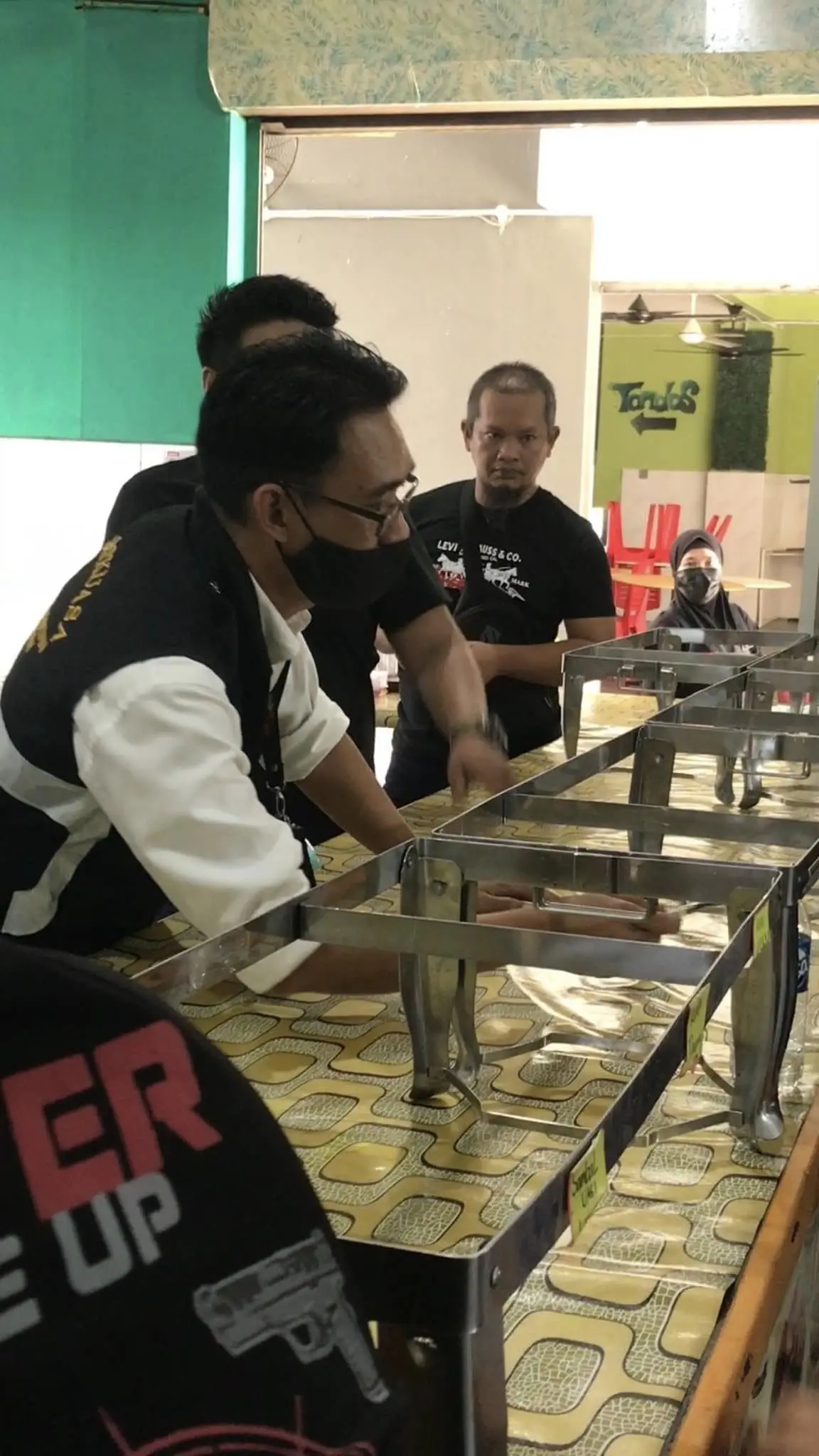 Sabah health officials inspecting the restaurant