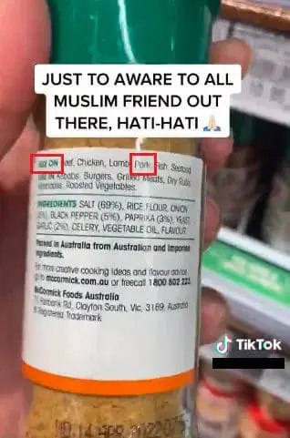 Woman holding a bottle of McCormick Cajun Seasoning 