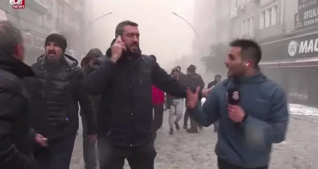 Reporter Yuksel Akalan doing a live broadcast of Turkey earthquake
