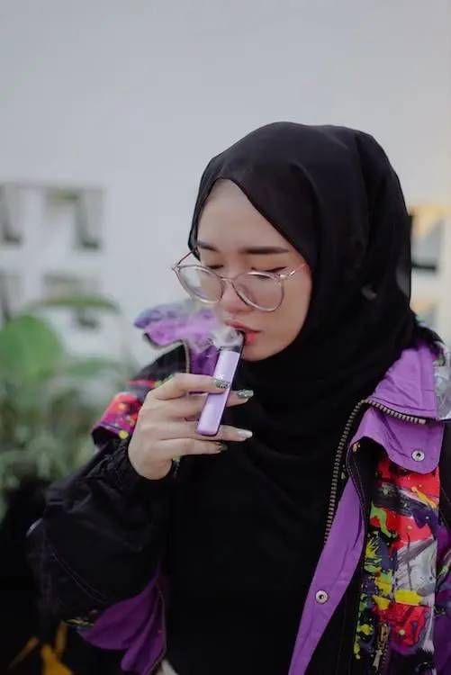 M'sians Have Mixed Reactions Over Post Of Hijab-Clad Woman Vaping By Public Health Malaysia