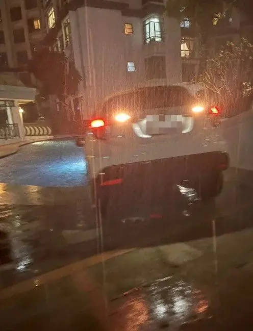 Carpooling Gone Wrong: E-Hailing Driver Accidentally Drives Into Swimming Pool Amid Heavy Downpour