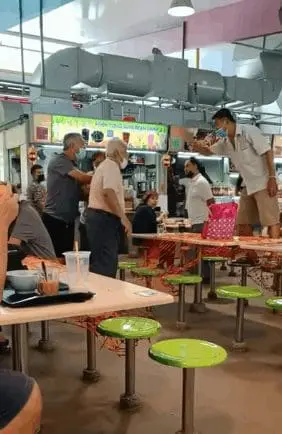 Fierce fight on the table breaks out between two elderly men over seating in Singapore.