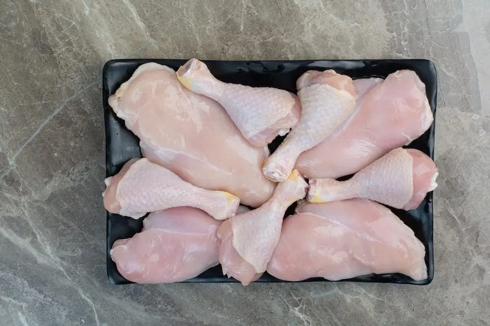 Plate of raw chicken