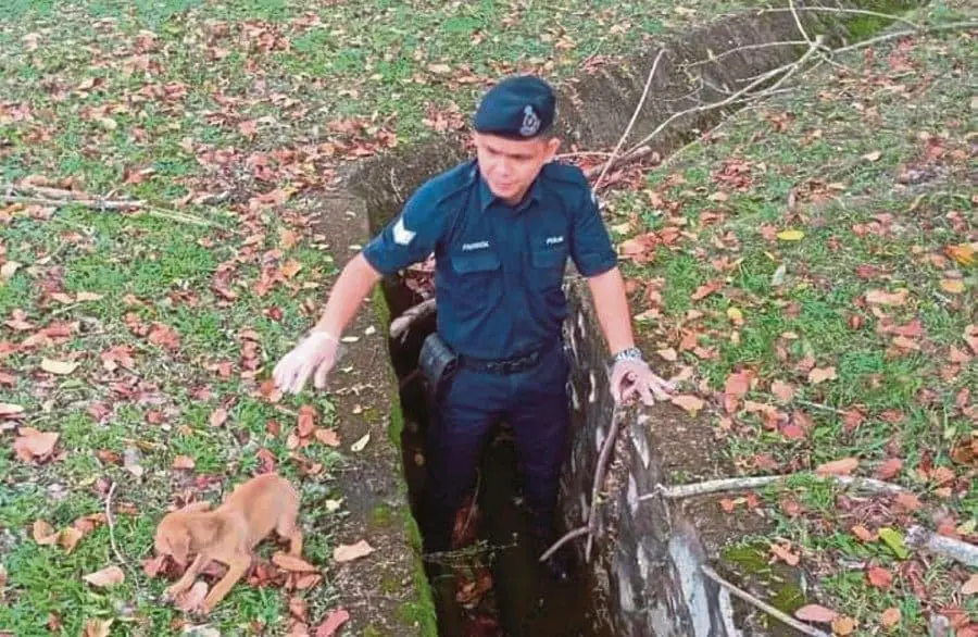 Malay M'sian Police Officer Rescues Puppy From Drain, Wins Praise Online