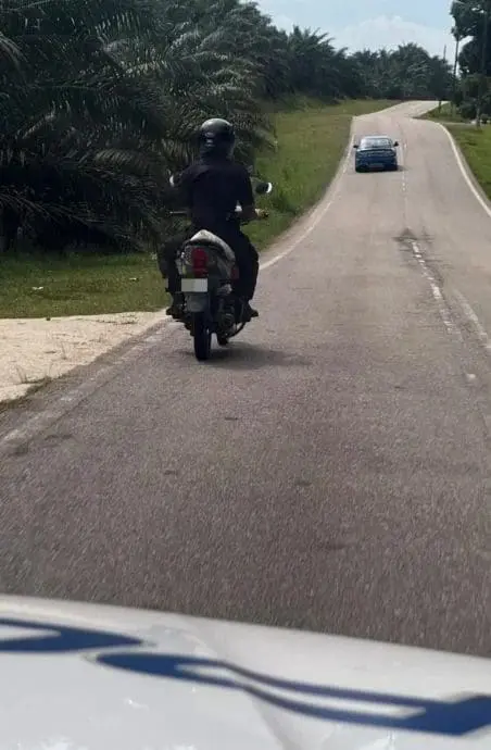 police brings them in the car to their home while another police man rides their bike