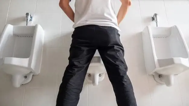 Man peeing in a toilet 