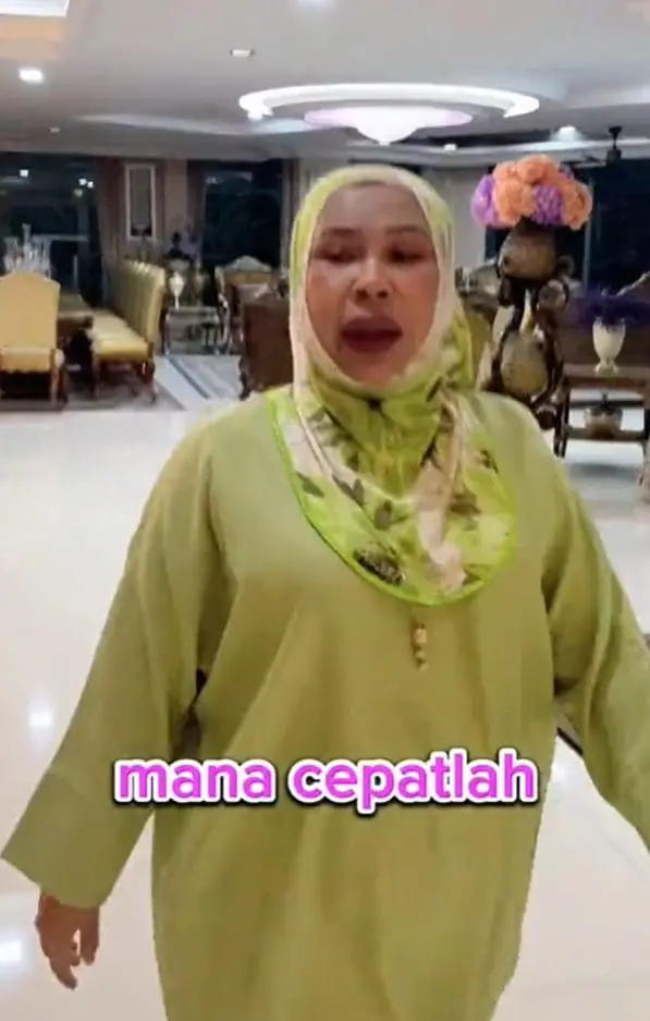 Dato Seri Vida walking inside of her house