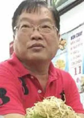 Teo Boon Ching in red shirt