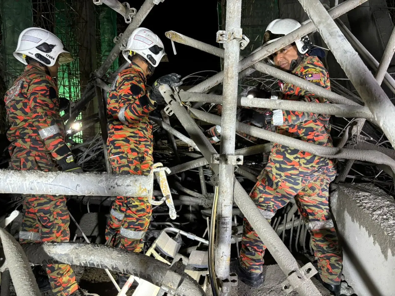 Firefighters looking for victims after building collapses in Penang