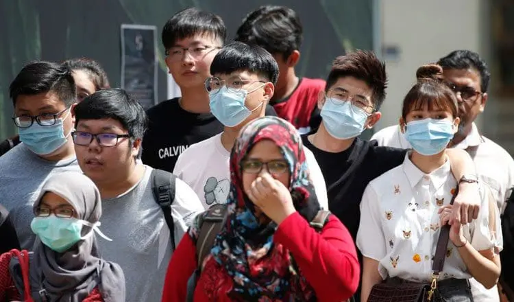 Malaysians wearing face masks