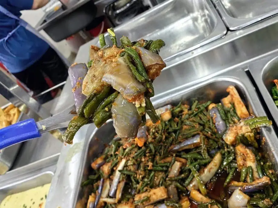 A spoonful of vegetables at chap fan restaurant in Sungai Petani